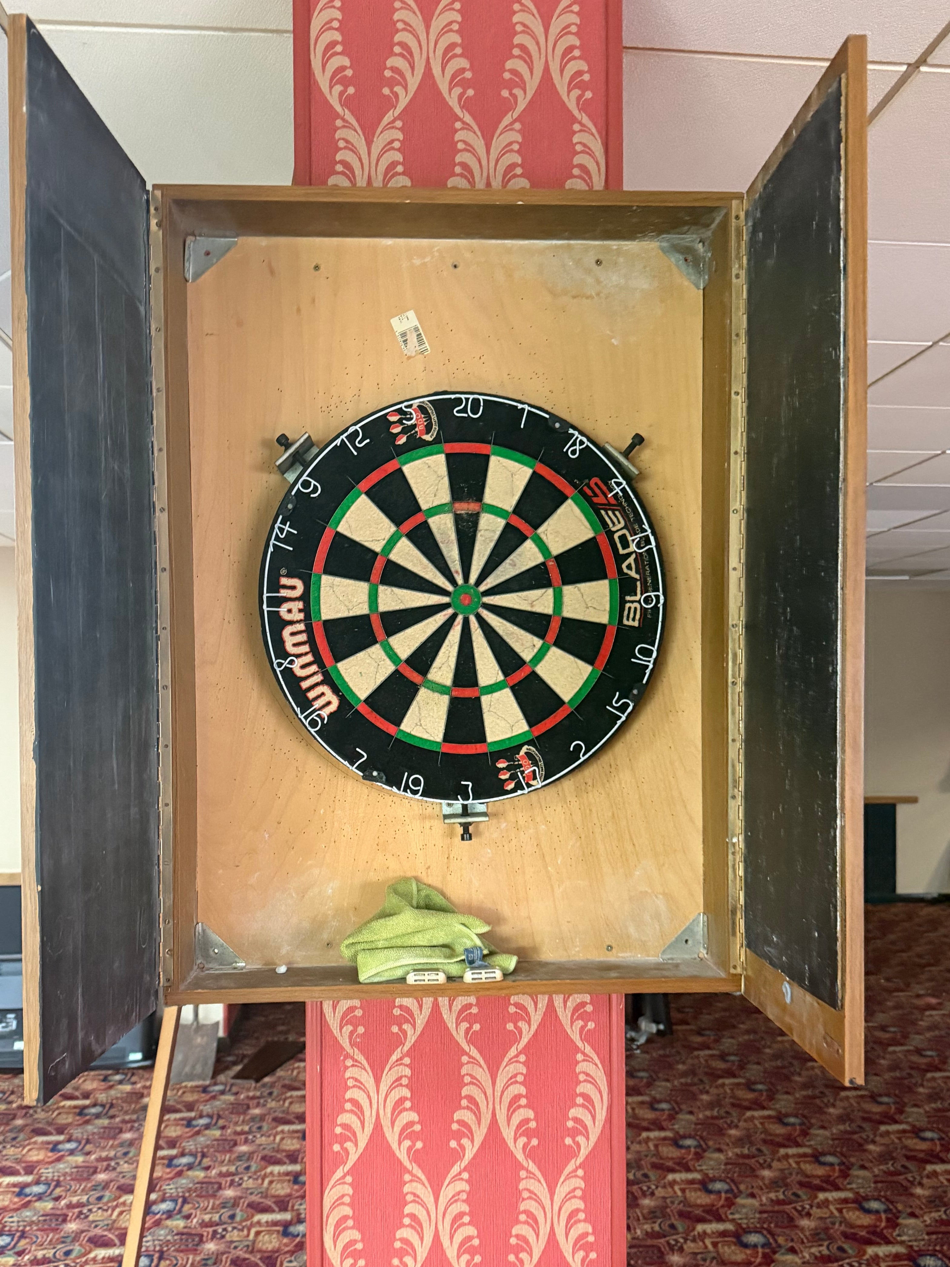 Dart board in wooden scoreboard box